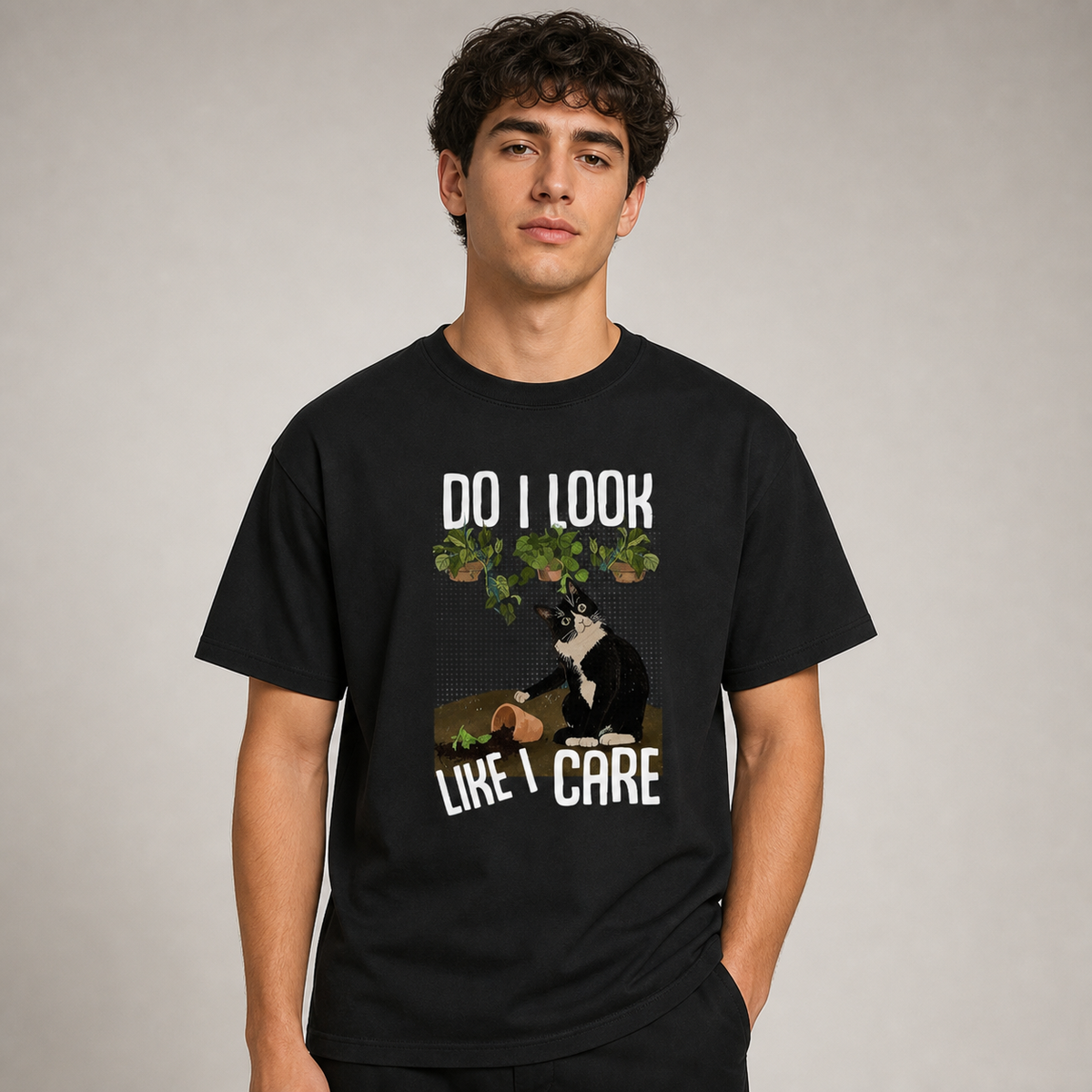Front studio view of adult model wearing black cat graphic crew-neck T-shirt