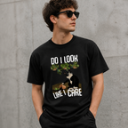 Adult model wearing black WEAVVI cat graphic T-shirt in an urban setting